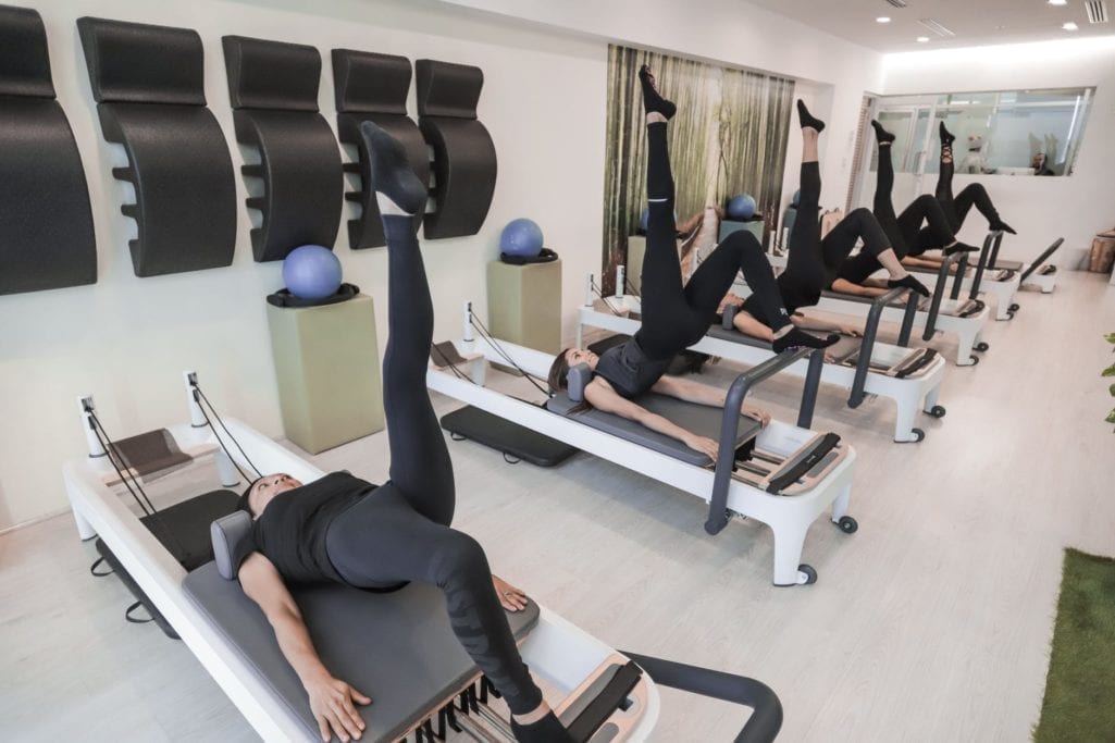 women doing exercise routine inside room