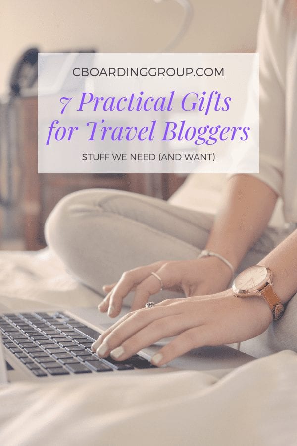 Cover Image Girl on Bed with Laptop from 7 Practical Gifts for Travel Bloggers