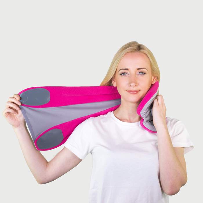 Image of Women Putting the Trtl Pillow Plus On