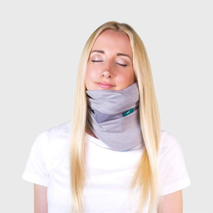 Image of a Woman with Trtl Pillow Plus On and Eyes Closed