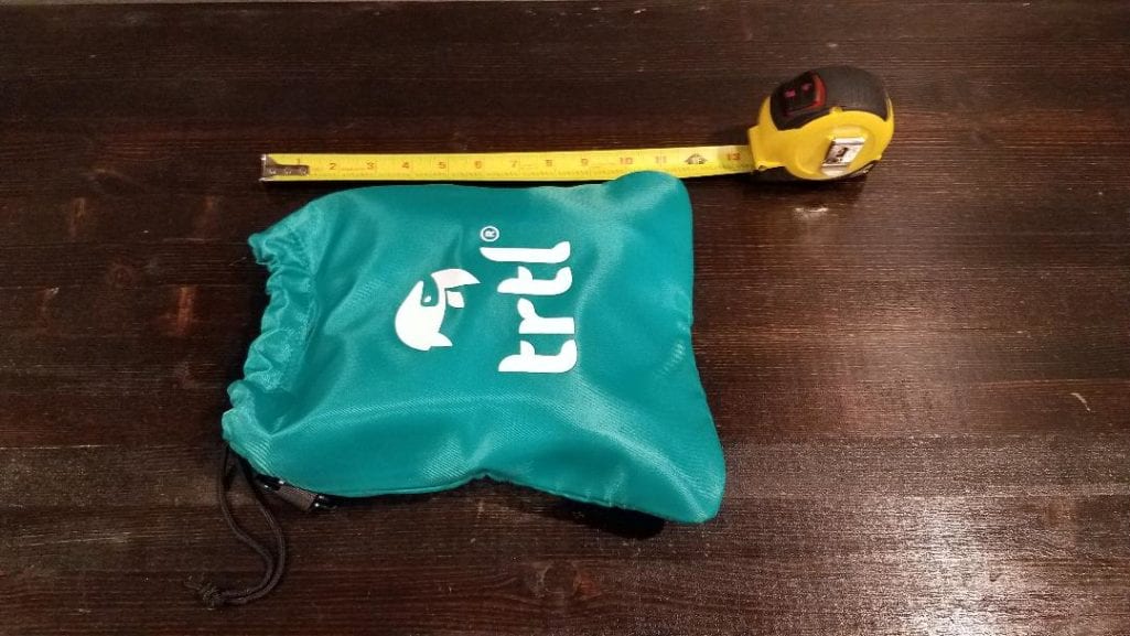 a measuring tape and a bag on a table