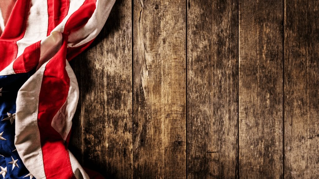 Image of Flag over wooden planked wall
