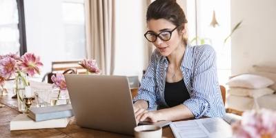Image of woman working remotely from home