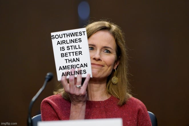 a woman holding a sign