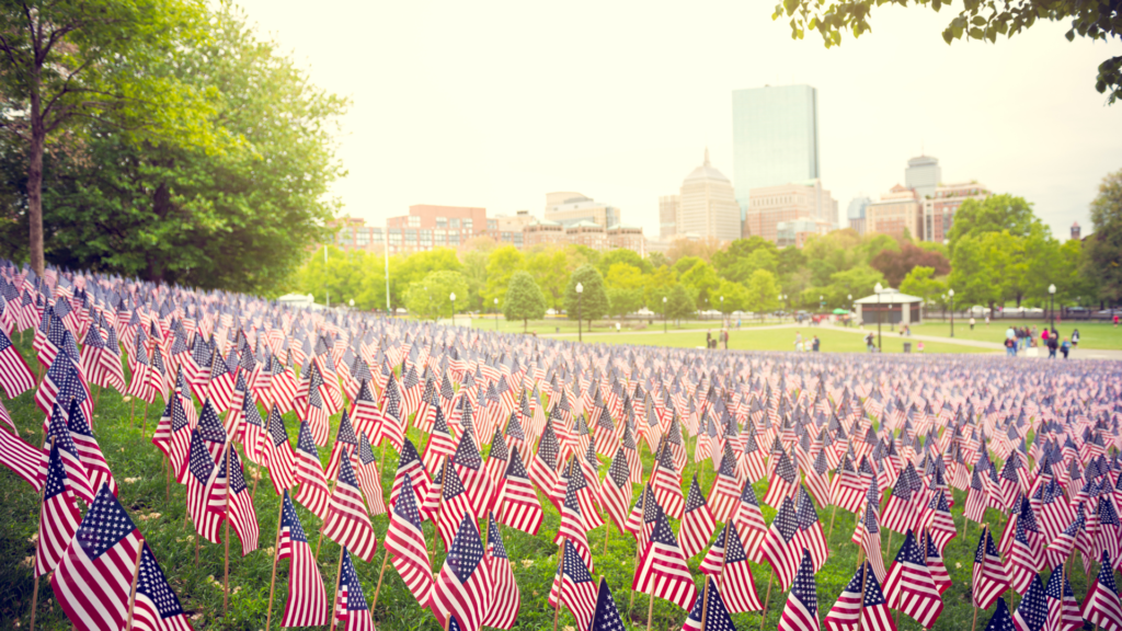 Image of field of flags at gravestones for memorial day