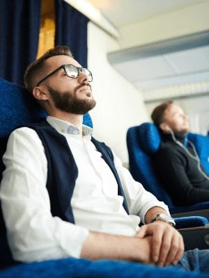 Image of man sleeping on a plane