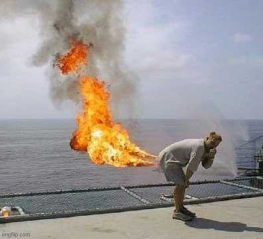 a man on fire with a fireball coming out of his pants