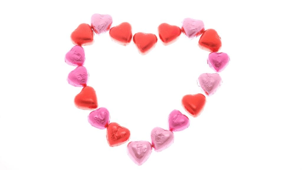 a heart shaped candy on a white background