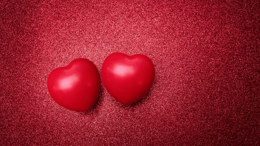 two red hearts on a red background