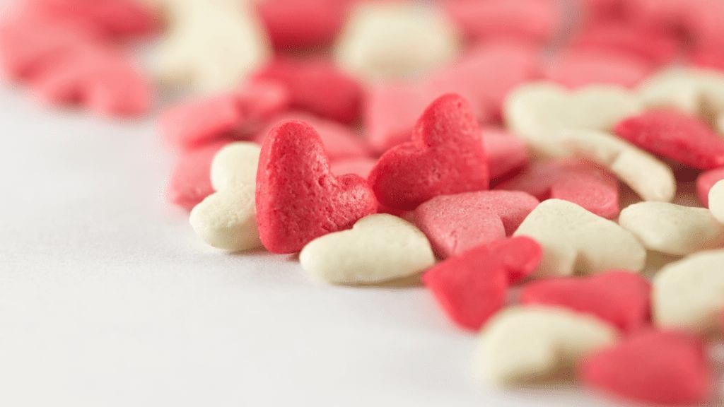 a pile of heart shaped candies