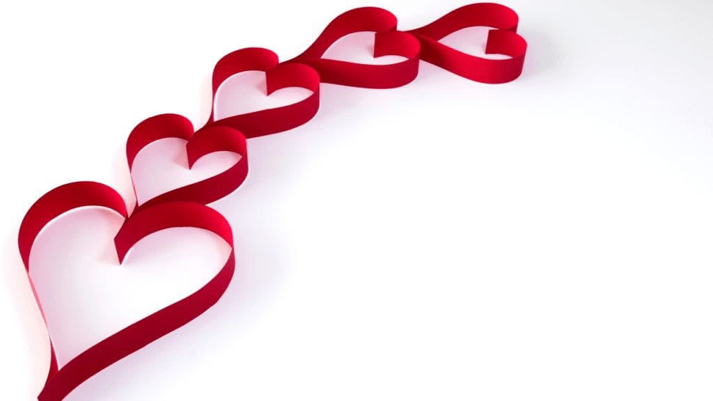 a red ribbon in the shape of hearts