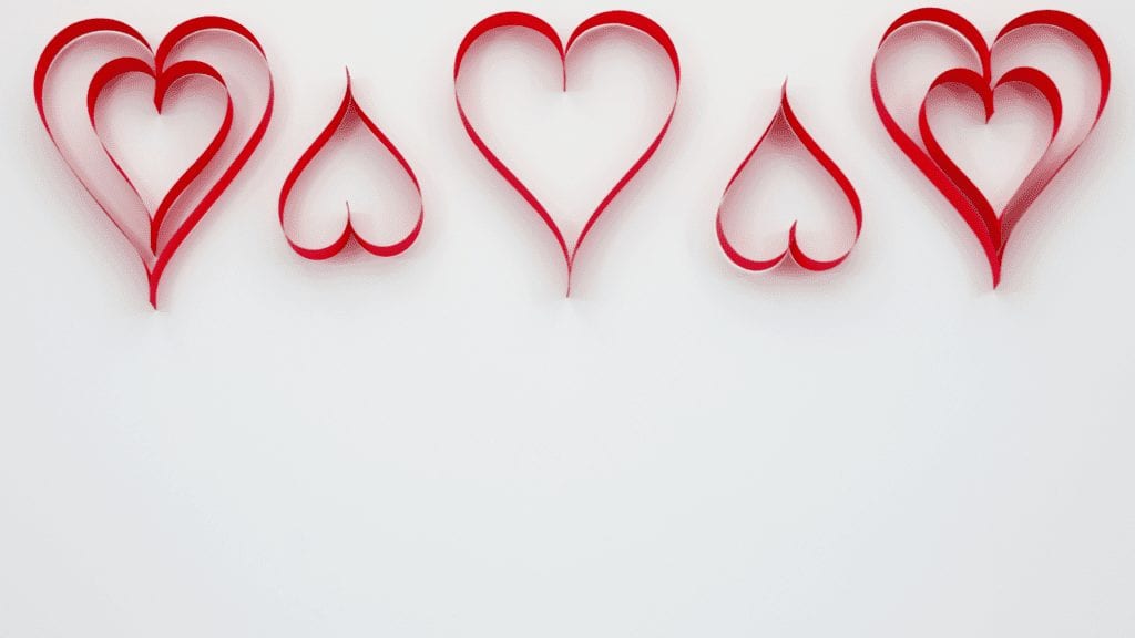a red heart shaped ribbon
