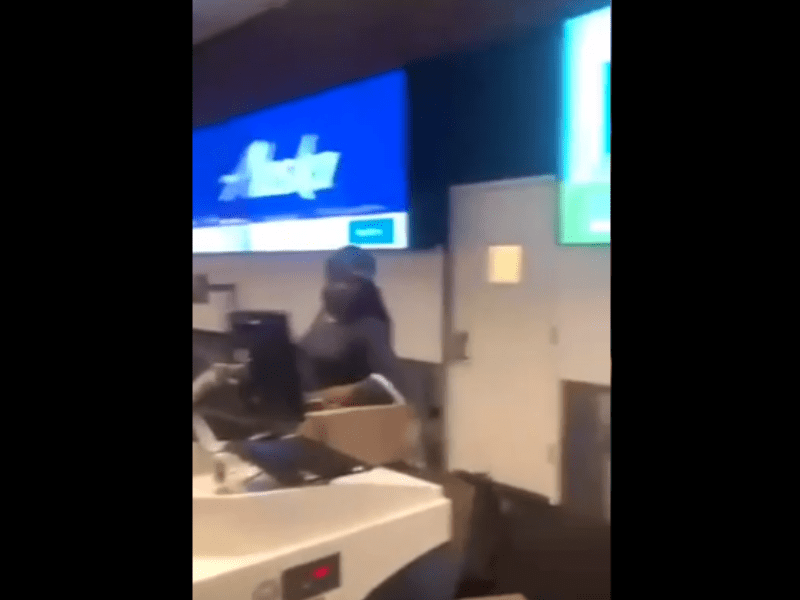 Woman loses it at airport check-in, violently storms the counter while child ple..