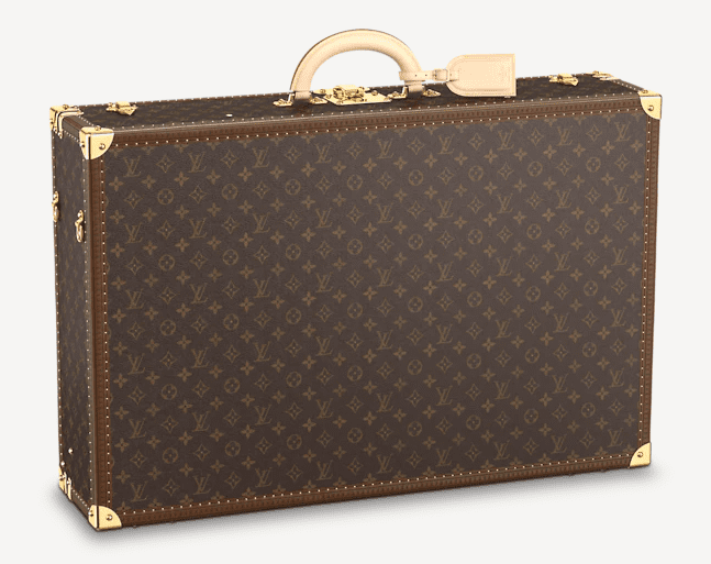 a brown suitcase with gold accents