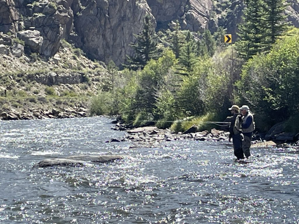 Image of two men fishing on Arkansas River